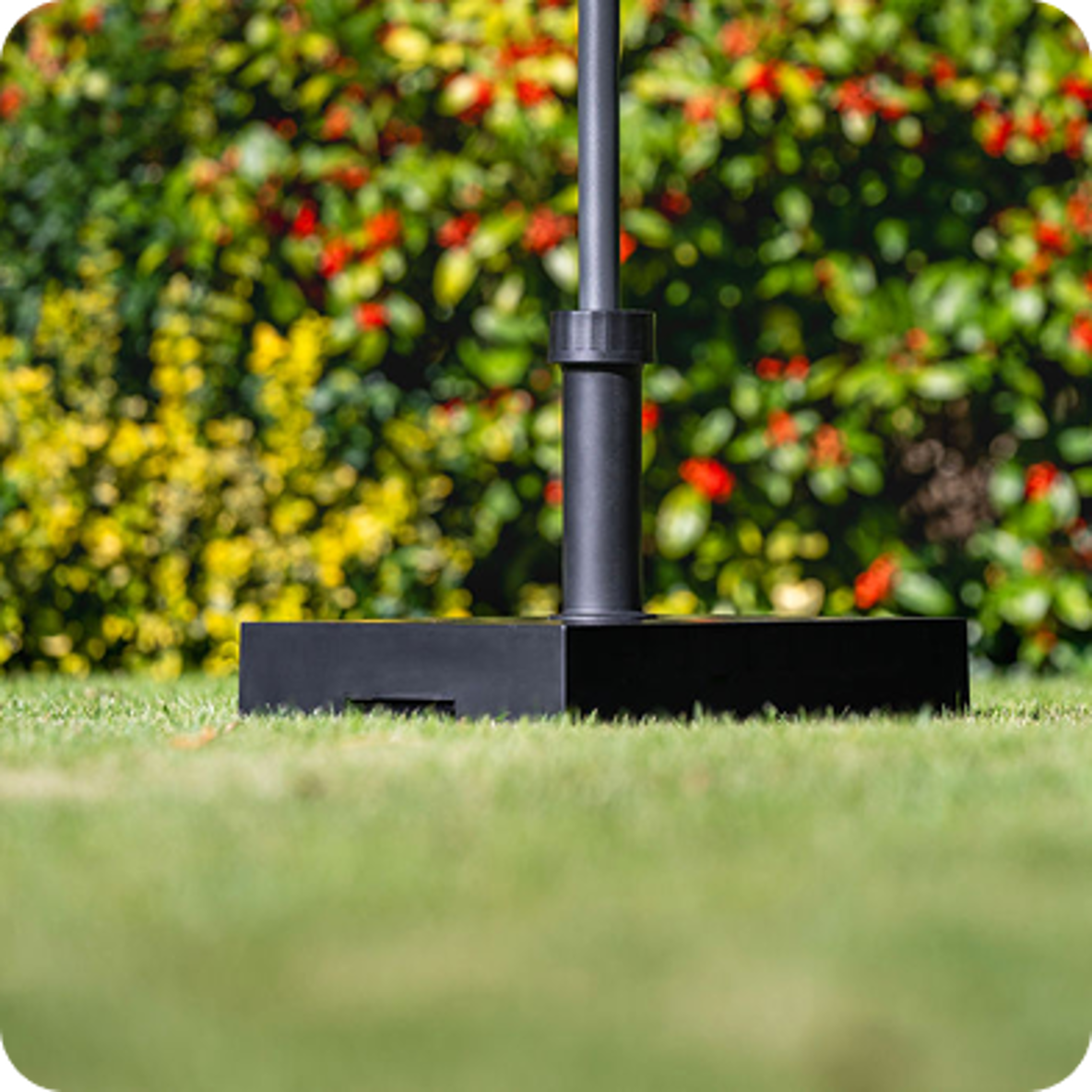 Black parasol in garden